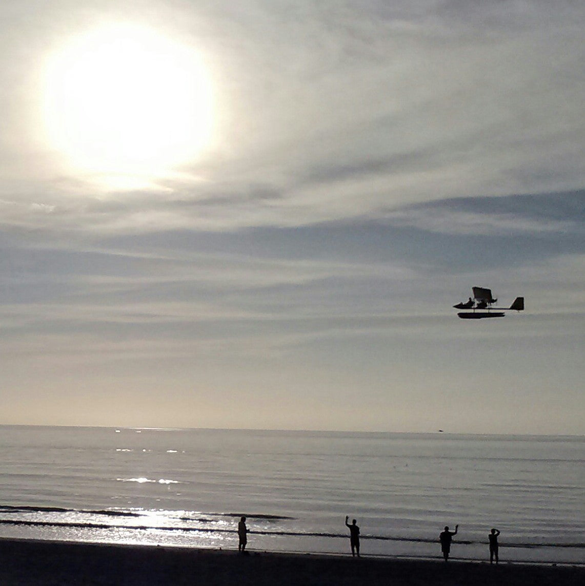 Drifter flying along the beach before sunset.